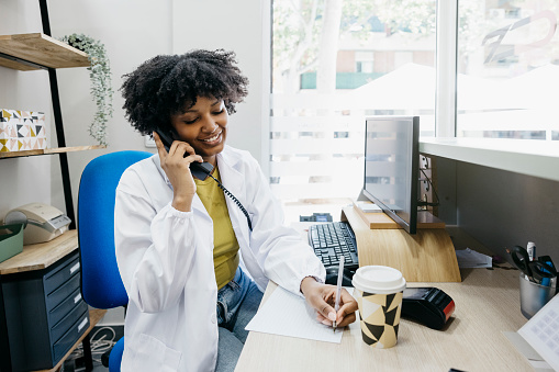 Doctor talking on the phone.